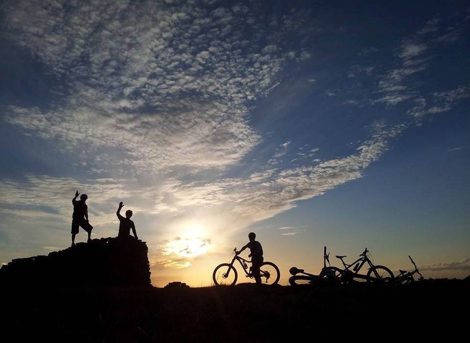 silohette of cyclist against a sky