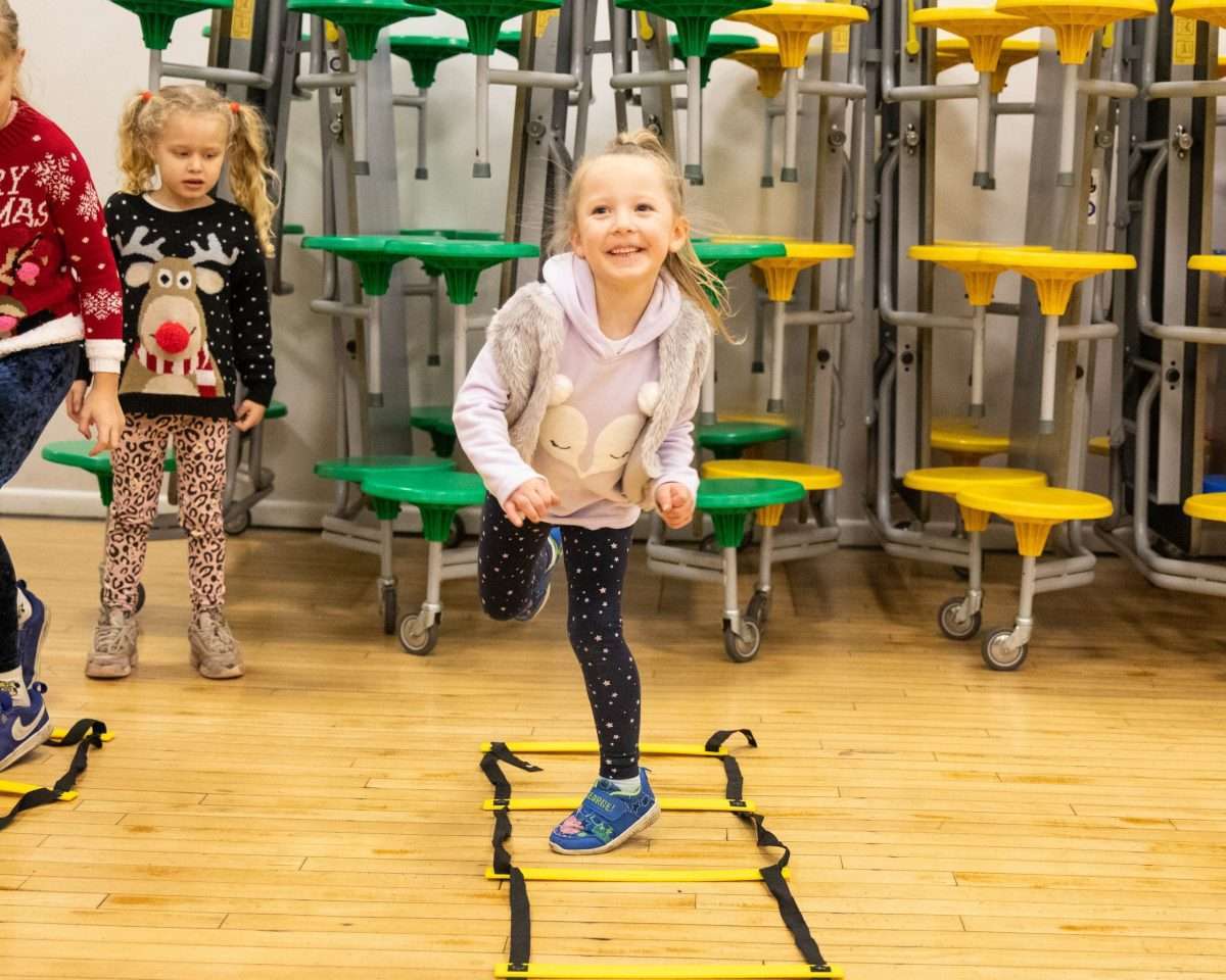 HAF 2 little girl smiling and skipping