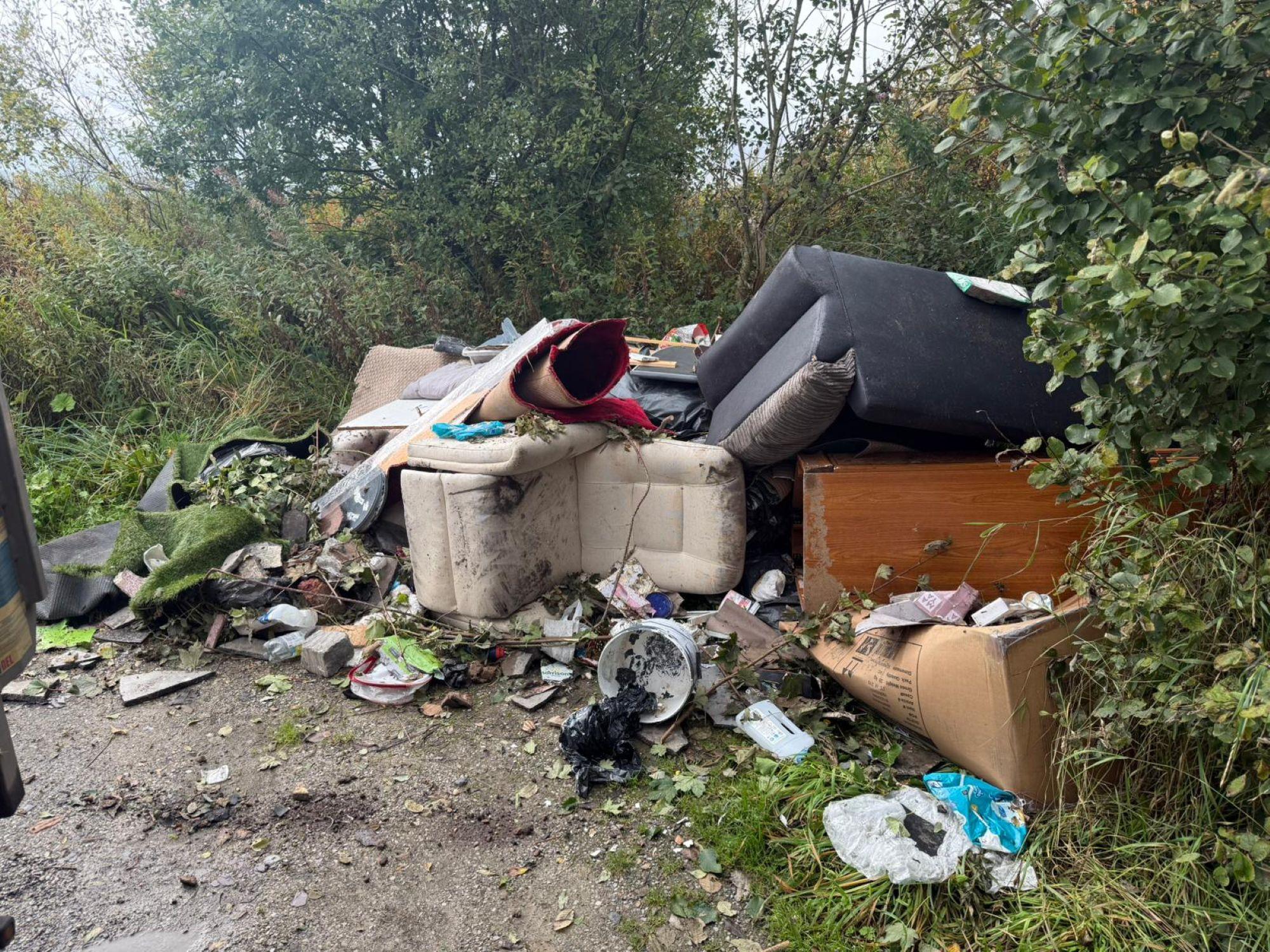 Piles or rubbish that have been left at Haslingden Halo from a fly-tipper.