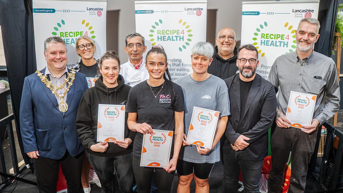 Picture of Rossendale business owners holding up their Recipe 4 Health Bronze Award