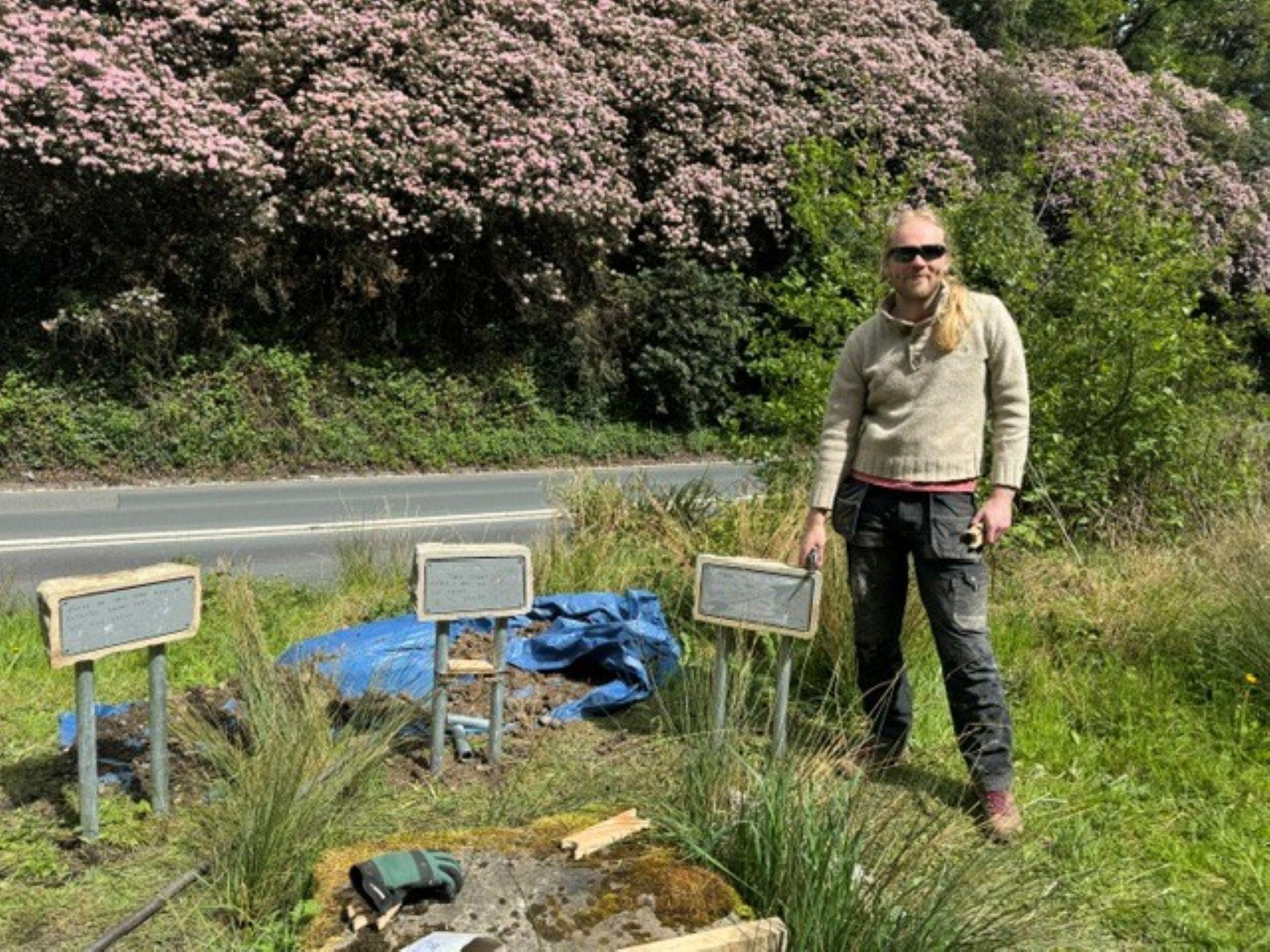 Jasper Howard, local artist with Waterfoot signs