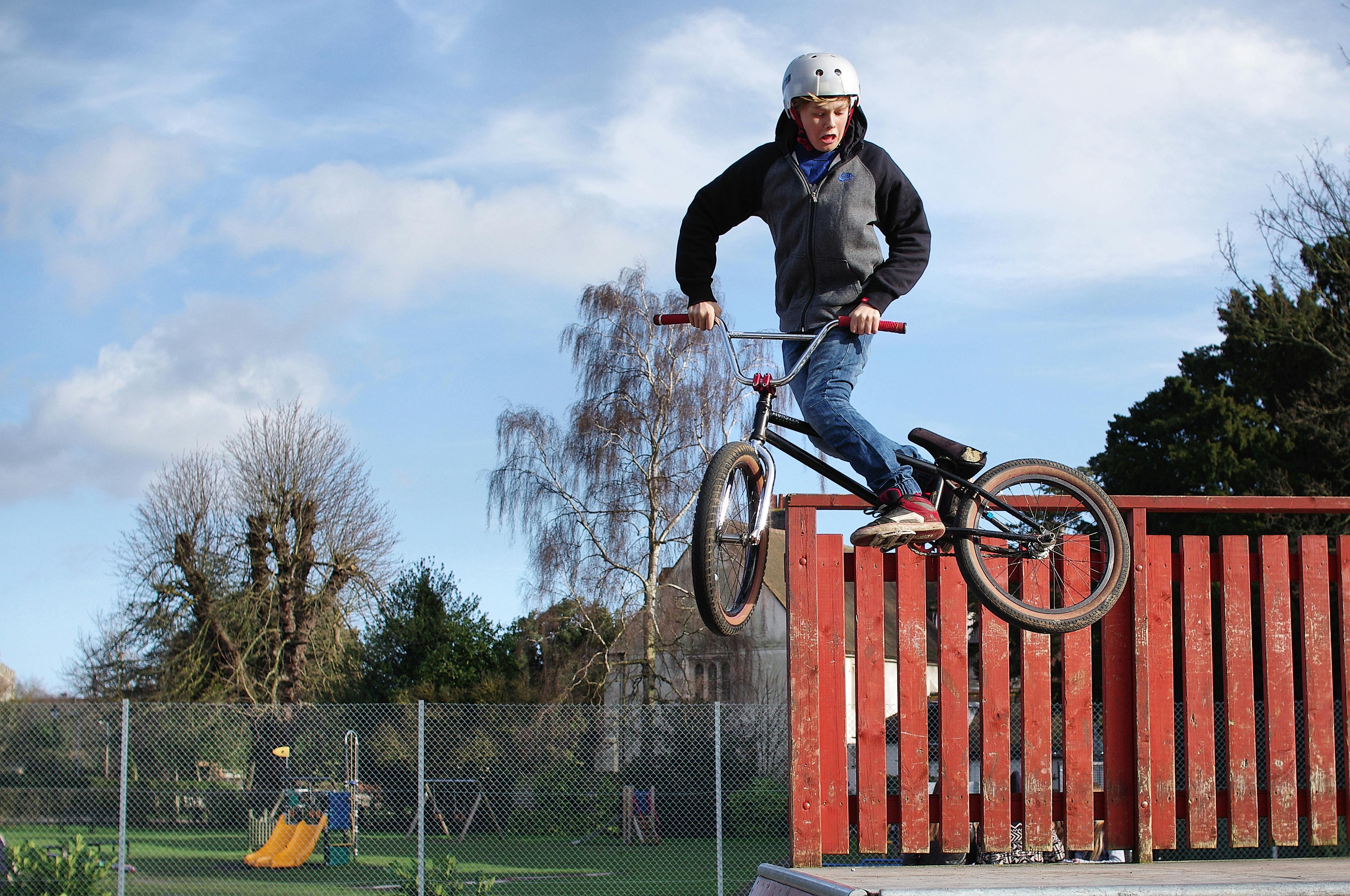 PICTURE OF A BOY JUMPING ON A BMX